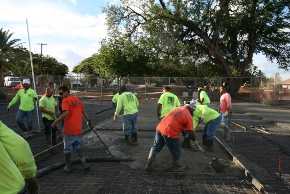A MIRA crew placing and finishing concrete flatwork on a Hawaiʻi jobsite.